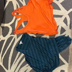 Two brand ladies tank tops, one is orange , one is blue striped